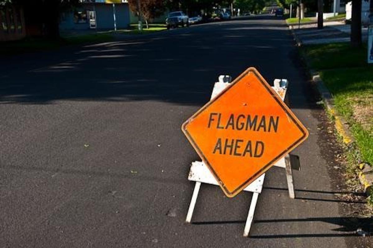 Flagman Ahead sign