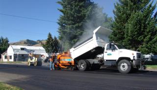 City of La Grande paving crew, dump truck, and paver
